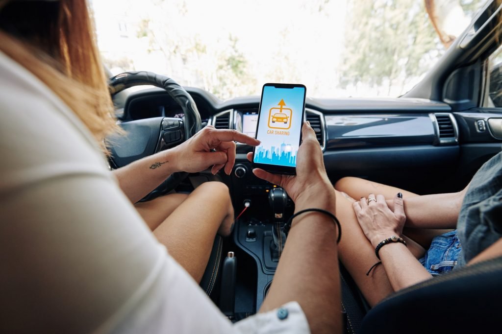 Driver checking car sharing app